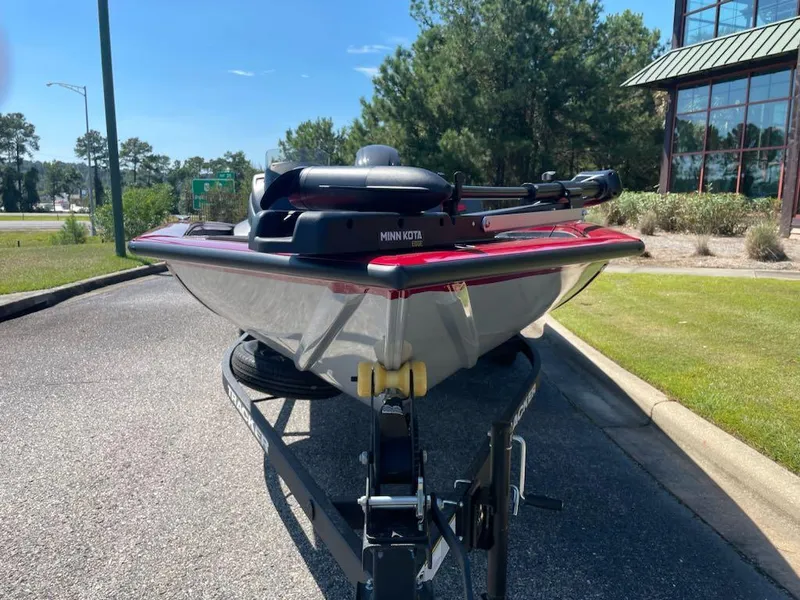 Slide: The Image of 2025 Tracker Pro Team 175 Crappie Edition boat on trailer, parked outdoors. - 5