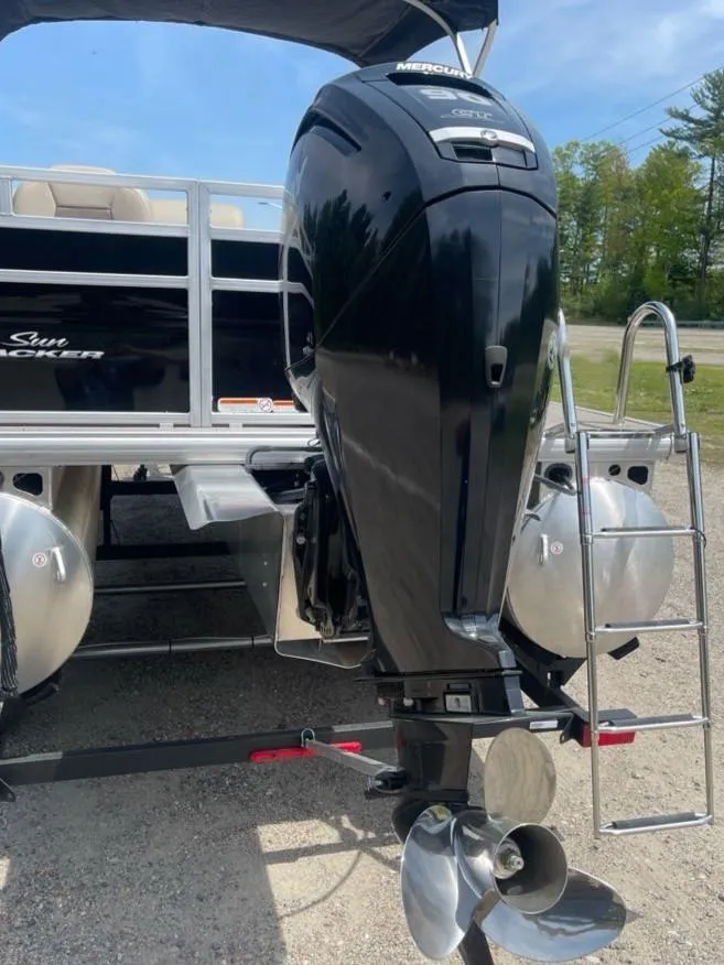 Slide: The Image of 2025 Sun Tracker SportFish 20 DLX pontoon boat with powerful outboard motor. - 6