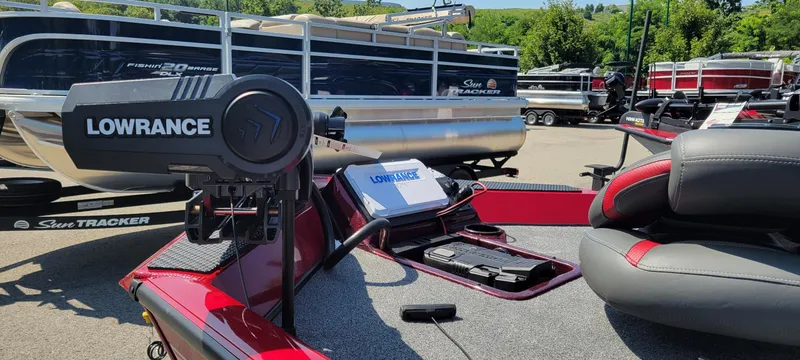 Slide: The Image of 2025 Ranger RT188P boat with Lowrance equipment, surrounded by other boats in a sunny outdoor setting. - 2
