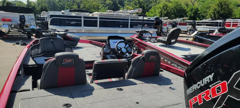 Slide: The Image of 2025 Ranger RT188P boat with Mercury Pro motor, displayed outdoors among other boats. - 3