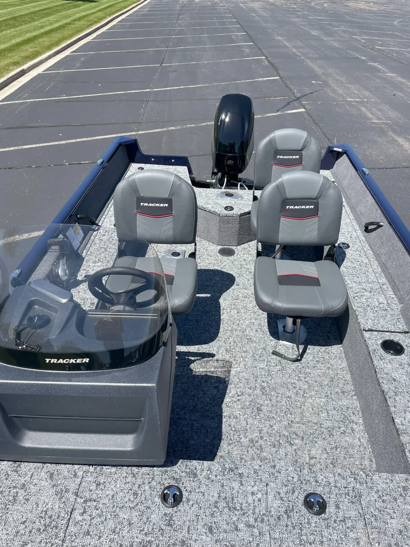 Slide: The Image of 2025 Tracker Pro Guide V-16 SC boat with dual seats and steering console. - 3