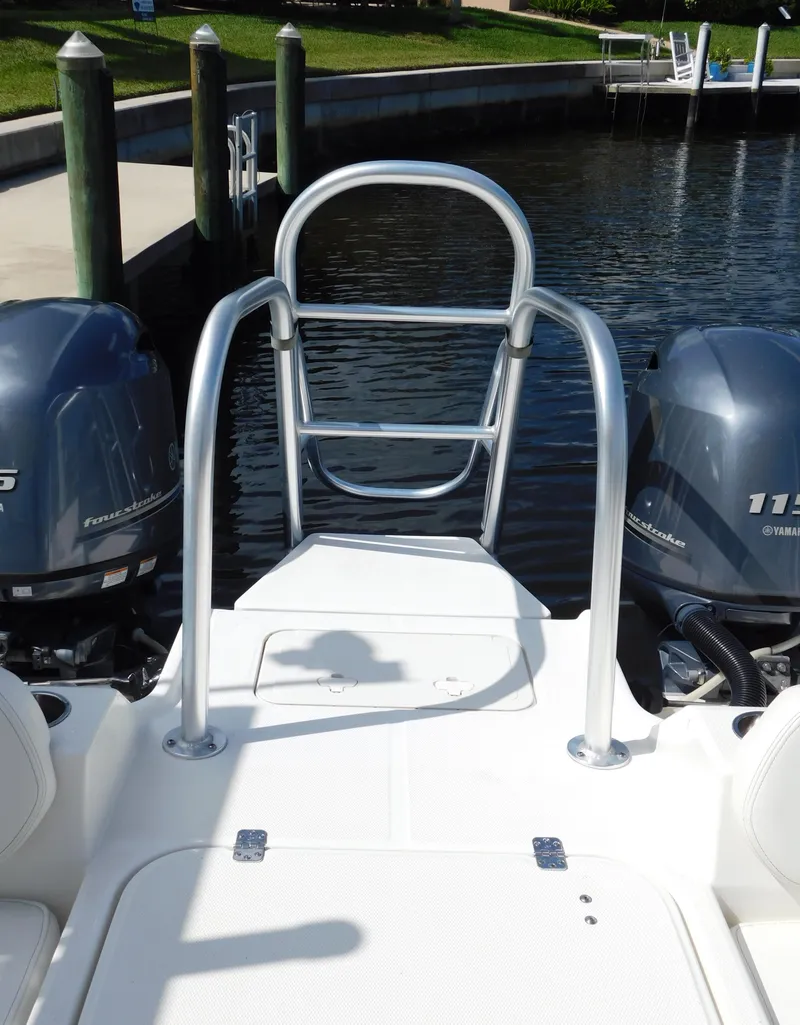 Slide: The Image of 2020 World Cat 230 DC boat with dual engines docked at marina. - 11