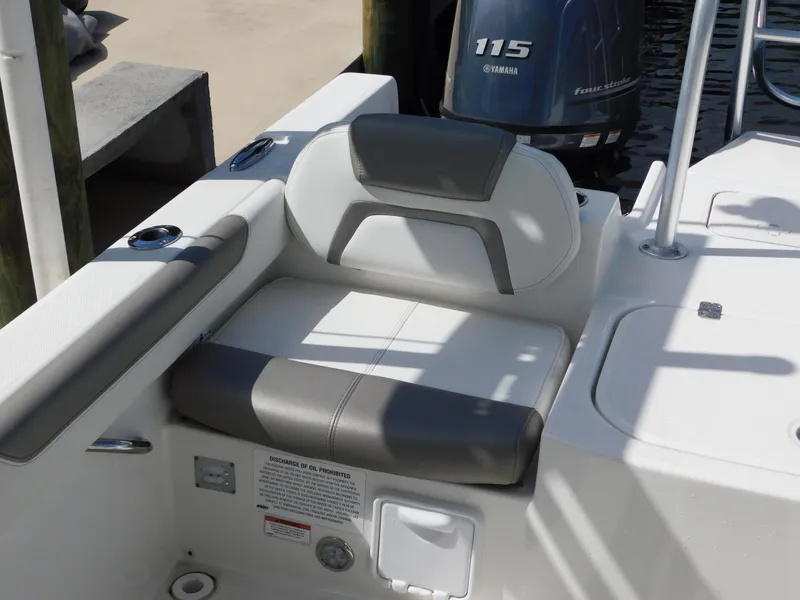 Slide: The Image of 2020 World Cat 230 DC boat seat with Yamaha 115 engine in background. - 12