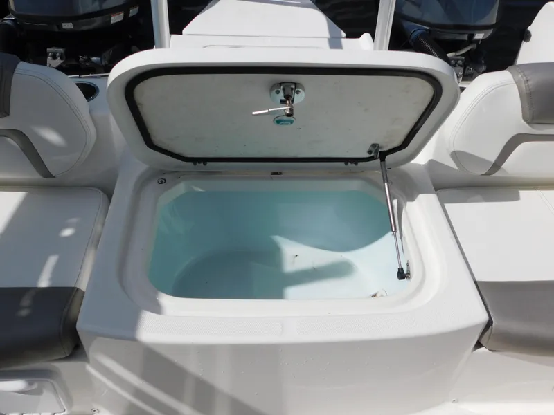 Slide: The Image of Open storage compartment on 2020 World Cat 230 DC boat. - 13