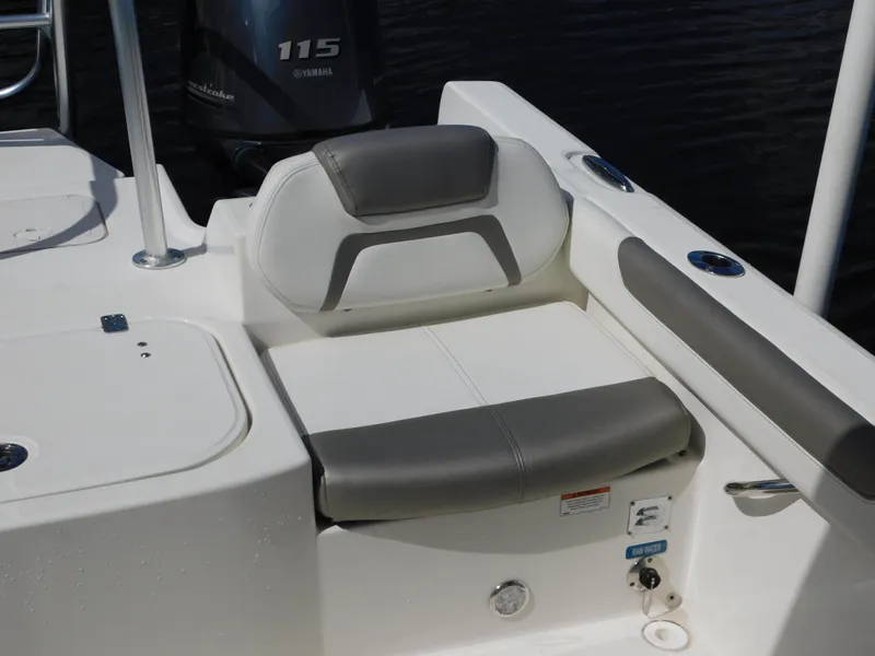 Slide: The Image of 2020 World Cat 230 DC boat seat with gray and white upholstery, near Yamaha 115 engine. - 14