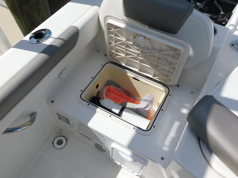 Slide: The Image of Storage compartment on 2020 World Cat 230 DC boat with safety gear inside. - 15