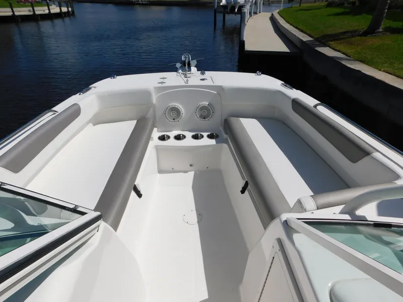 Slide: The Image of 2020 World Cat 230 DC boat interior with spacious seating and cup holders. - 25