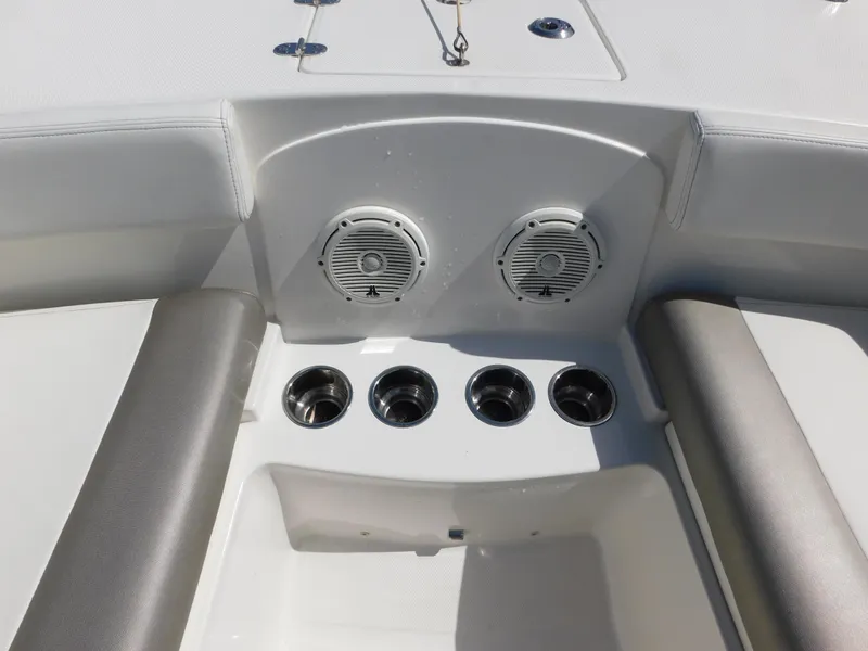Slide: The Image of 2020 World Cat 230 DC boat interior with speakers and cup holders. - 26