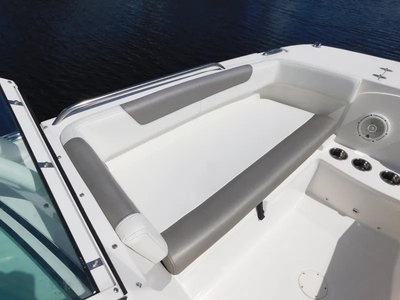 Slide: The Image of 2020 World Cat 230 DC boat seating area with gray and white upholstery. - 27