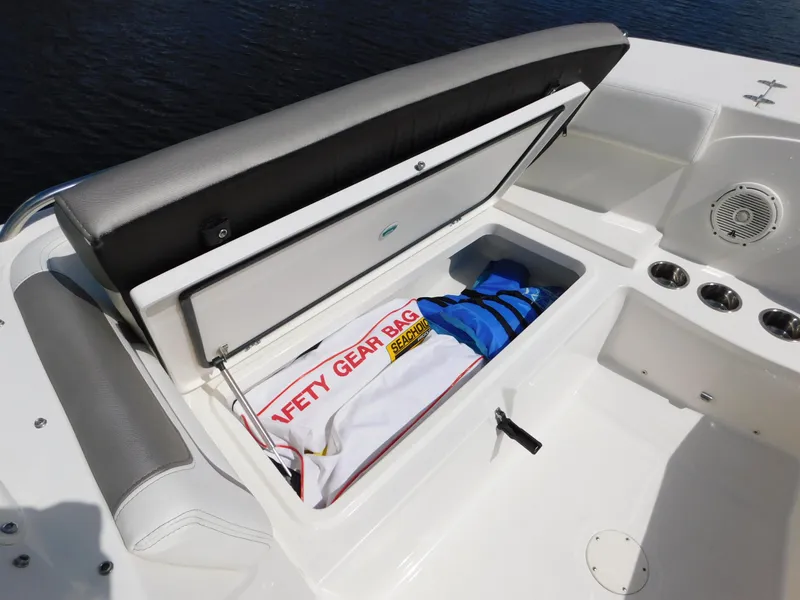 Slide: The Image of Storage compartment on 2020 World Cat 230 DC boat with safety gear bag and life jacket. - 28