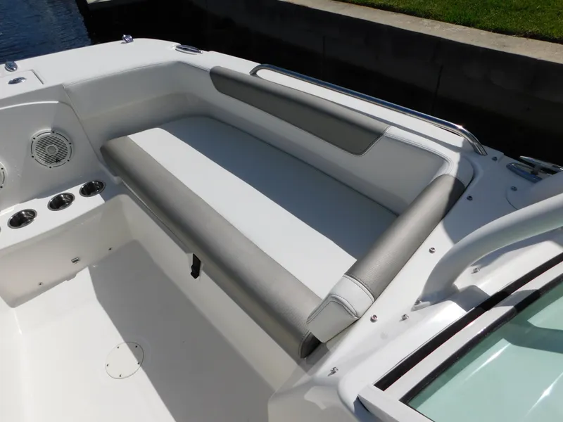 Slide: The Image of 2020 World Cat 230 DC boat interior with cushioned seating and cup holders. - 29