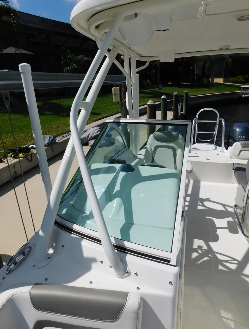 Slide: The Image of 2020 World Cat 230 DC boat with open deck and seating area. - 37