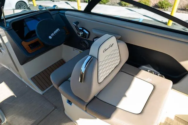 Slide: The Image of 2025 Chris-Craft 25 Sportster interior with luxurious seating and modern controls. - 12