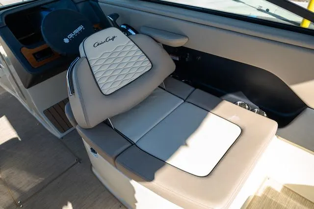 Slide: The Image of 2025 Chris-Craft 25 Sportster interior with luxurious seating and elegant design. - 14