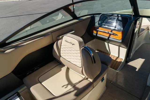 Slide: The Image of Interior of 2025 Chris-Craft 25 Sportster boat, featuring luxurious seating and dashboard. - 17