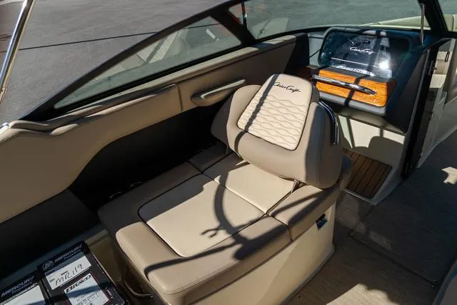 Slide: The Image of 2025 Chris-Craft 25 Sportster interior with beige seating and elegant design. - 18