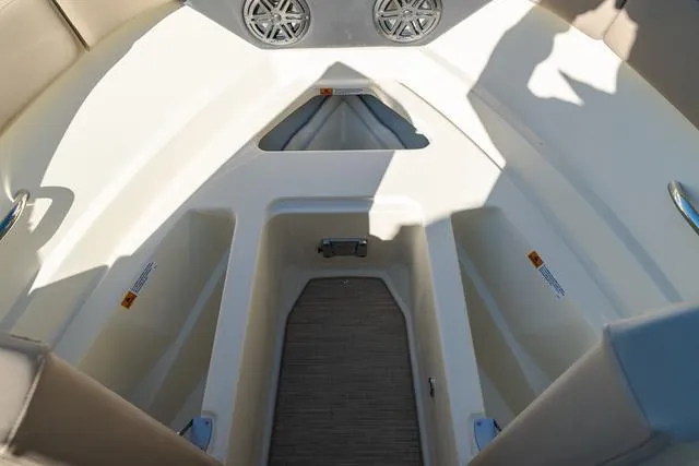 Slide: The Image of 2025 Chris-Craft 25 Sportster boat interior with seating and storage compartments. - 23
