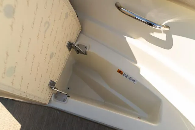 Slide: The Image of Open storage compartment in 2025 Chris-Craft 25 Sportster boat. - 24