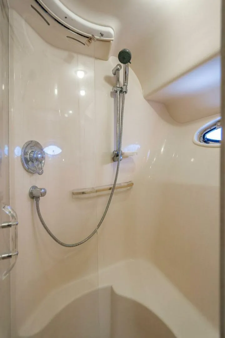 Slide: The Image of Shower area in 1999 Sea Ray 56 Sedan Bridge yacht, featuring sleek design and modern fixtures. - 20