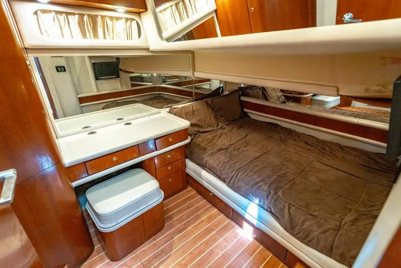 Slide: The Image of Luxurious cabin interior of 1999 Sea Ray 56 Sedan Bridge yacht with wood finish. - 21