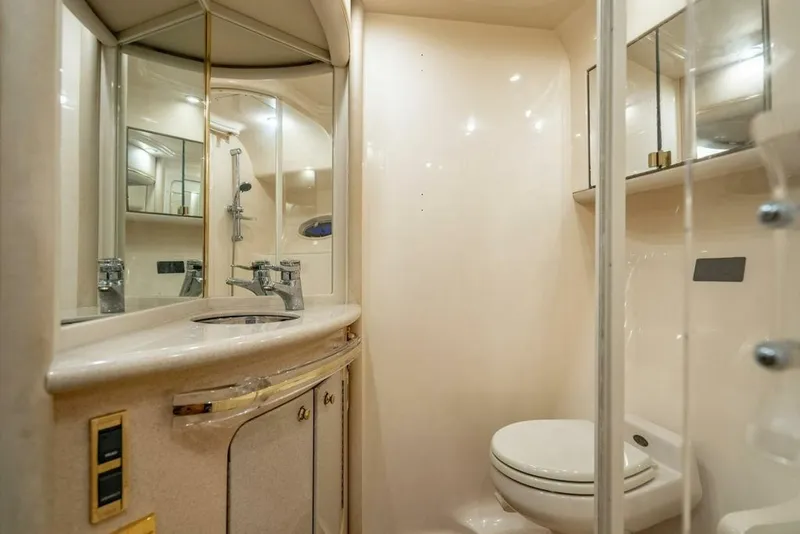 Slide: The Image of Luxurious bathroom in 1999 Sea Ray 56 Sedan Bridge yacht, featuring modern fixtures and elegant design. - 23