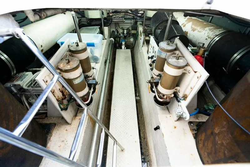 Slide: The Image of Engine room of 1999 Sea Ray 56 Sedan Bridge yacht, showcasing mechanical components. - 37