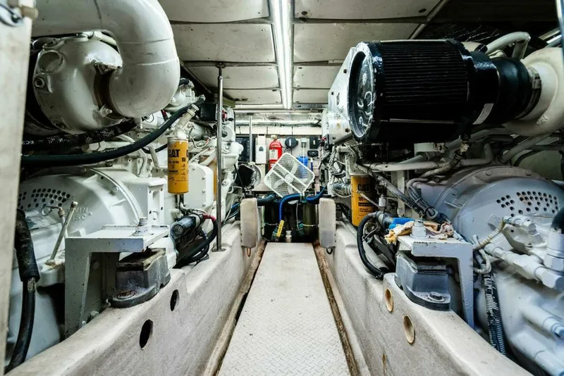 Slide: The Image of Engine room of 1999 Sea Ray 56 Sedan Bridge yacht, showcasing mechanical components and equipment. - 38