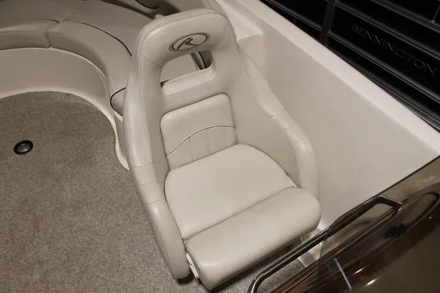 Slide: The Image of 2005 Kayot V220i boat interior with white seating and open deck on water. - 10