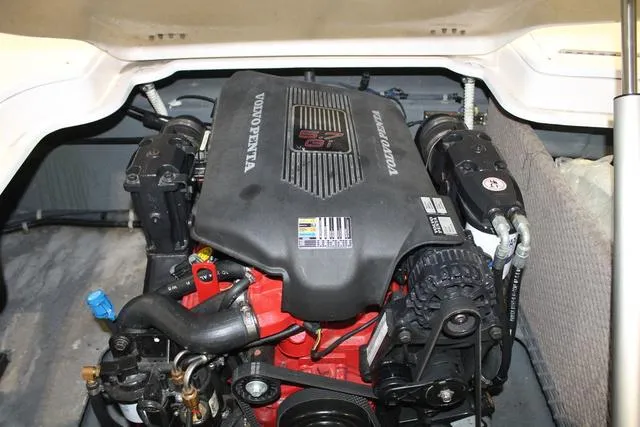 Slide: The Image of Battery compartment of 2005 Harris-Kayot V220 boat with visible wiring and connections. - 14