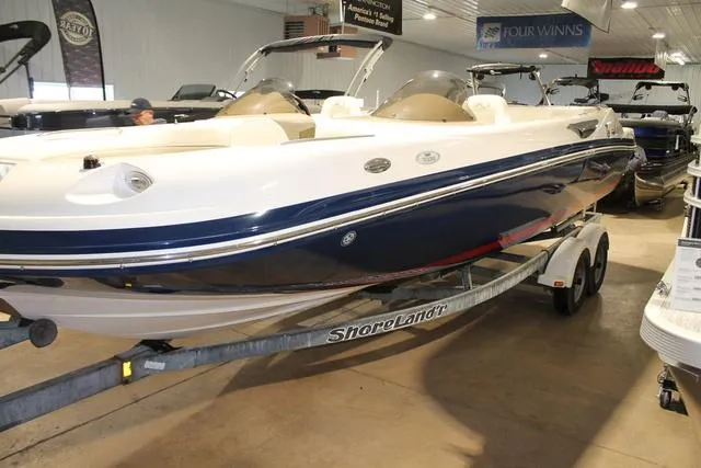 Slide: The Image of 2005 Kayot V220i boat interior with white cushioned seating and open deck space. - 4