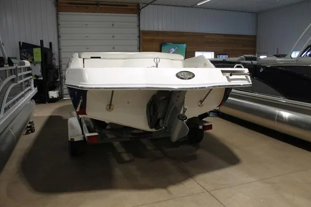 Slide: The Image of 2005 Kayot V220i dashboard with JVC stereo and warning label. - 5