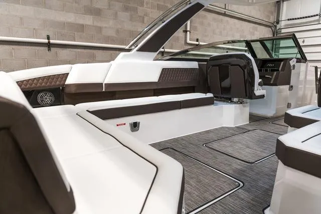 Slide: The Image of 2025 Cobalt R33 boat interior with sleek seating and modern design. - 12