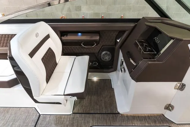 Slide: The Image of 2025 Cobalt R33 boat interior with luxurious seating and modern dashboard design. - 24