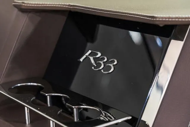 Slide: The Image of Interior of 2025 Cobalt R33 with sleek design and cup holders. - 25