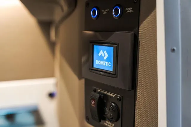 Slide: The Image of Control panel in 2025 Cobalt R33 featuring Dometic display and lighting controls. - 28