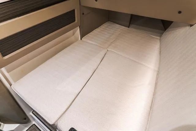 Slide: The Image of 2025 Cobalt R33 interior cabin with beige cushioned seating. - 30