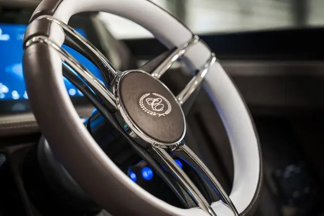 Slide: The Image of Steering wheel of 2025 Cobalt R33, featuring sleek design and modern controls. - 36