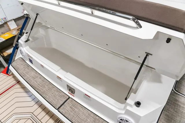 Slide: The Image of Open storage compartment of 2025 Cobalt R33 boat, showcasing spacious interior design. - 4