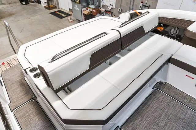 Slide: The Image of 2025 Cobalt R33 boat interior with white and brown cushioned seating, showcasing modern design. - 7