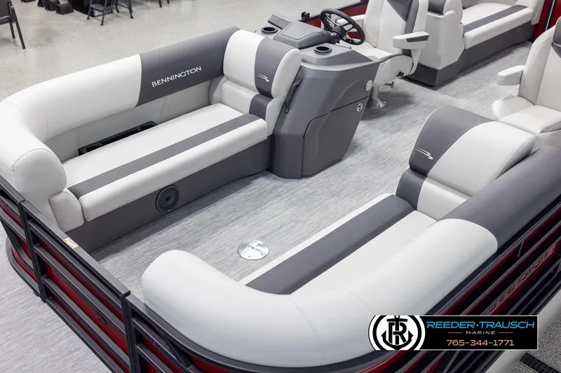 Slide: The Image of 2025 Bennington 22 SSRSE pontoon boat interior with plush seating and modern helm. - 10