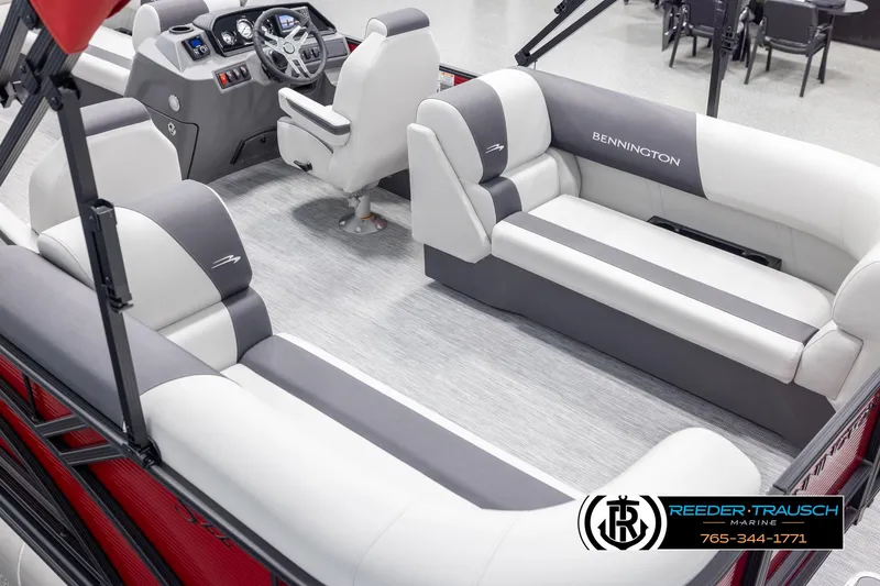 Slide: The Image of 2025 Bennington 22 SSRSE pontoon boat interior with plush seating and modern helm. - 11