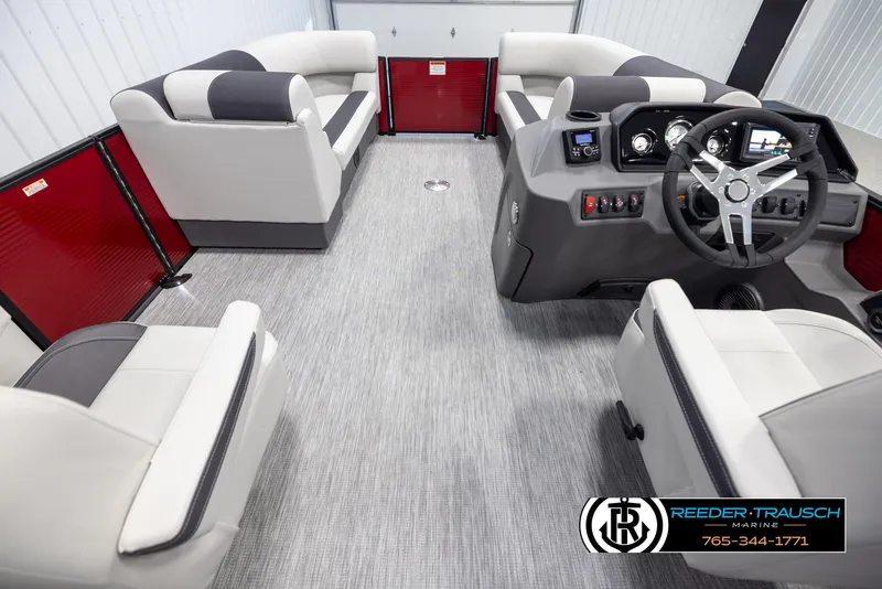 Slide: The Image of 2025 Bennington 22 SSRSE pontoon boat interior with modern seating and steering console. - 17
