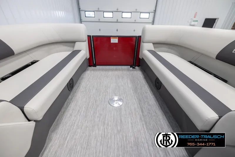 Slide: The Image of 2025 Bennington 22 SSRSE boat interior with gray seating and flooring, showcasing spacious design. - 18