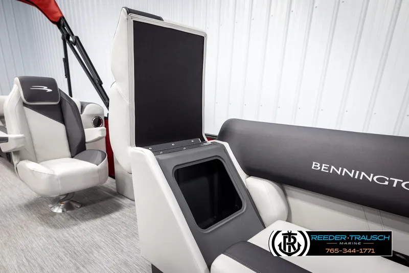Slide: The Image of 2025 Bennington 22 SSRSE boat interior with seating and storage compartment. - 22