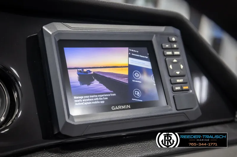 Slide: The Image of Garmin marine display on 2025 Bennington 22 SSRSE boat dashboard, featuring ActiveCaptain app. - 29