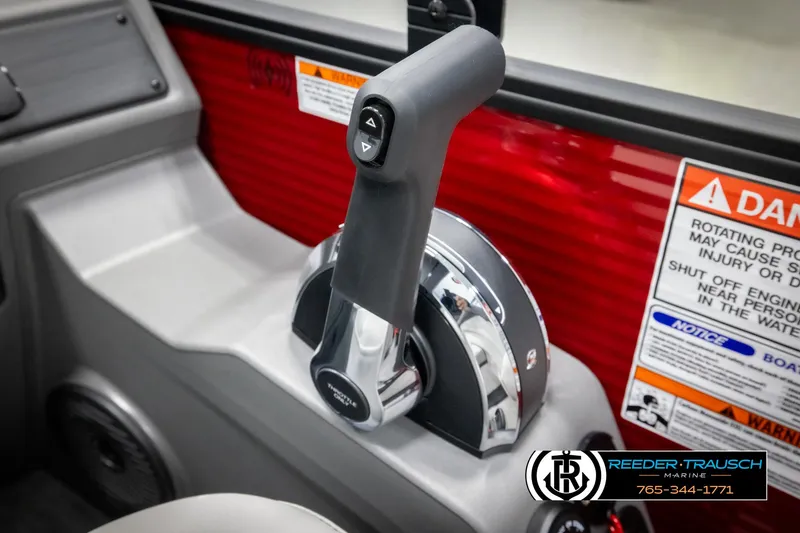 Slide: The Image of Throttle control of 2025 Bennington 22 SSRSE boat with warning labels and dealership logo. - 32