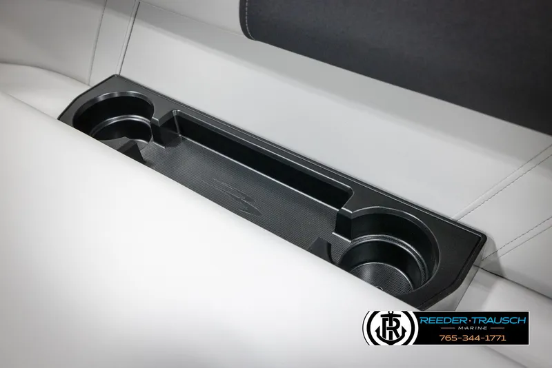 Slide: The Image of 2025 Bennington 22 SSRSE boat interior with cup holders and sleek white seating. - 36