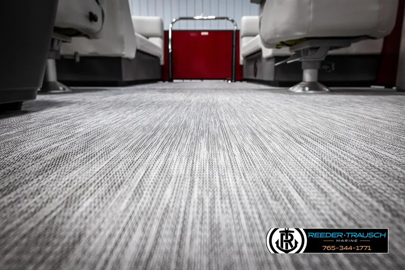 Slide: The Image of 2025 Bennington 22 SSRSE boat interior with textured flooring and seating. - 40