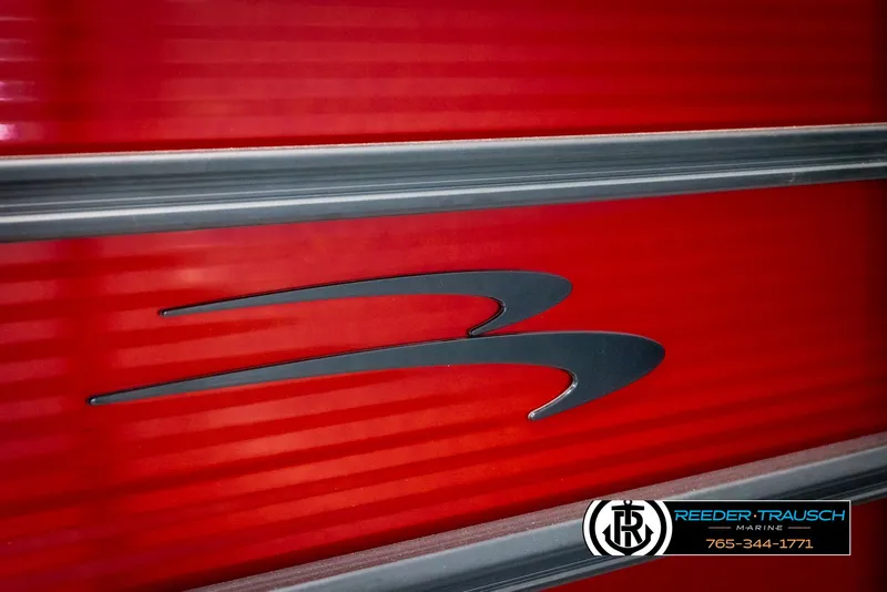 Slide: The Image of 2025 Bennington 22 SSRSE boat with sleek red exterior and logo detail. - 42