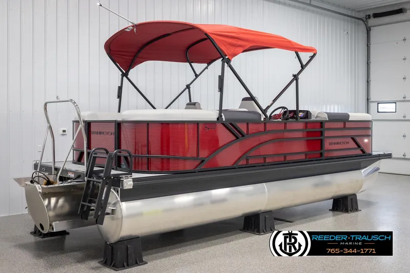 Slide: The Image of 2025 Bennington 22 SSRSE pontoon boat with red canopy in showroom. - 6